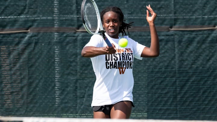 Westwood's Kinaa Graham makes a return on her way to the girls singles title at the District 25-6A tennis tournament at Old Settlers Park on April 4-5, 2022.