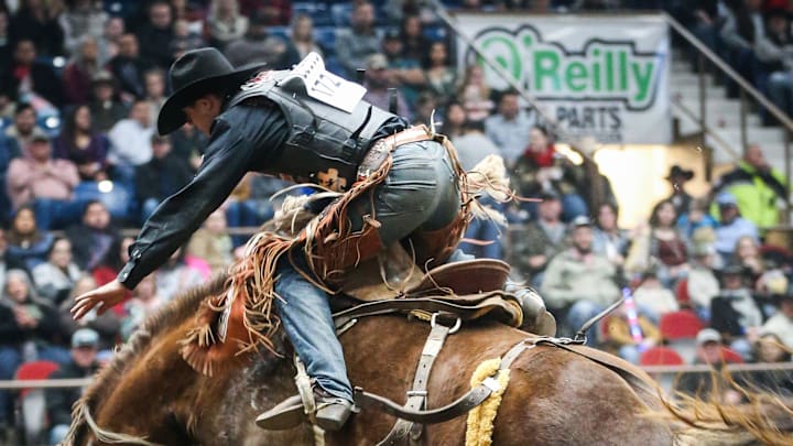 Brody Cress rides bronc named Blonde Lizard during the San Angelo Stock Show & Rodeo matinee show Saturday, Feb. 9, 2019, at Foster Communications Coliseum.
