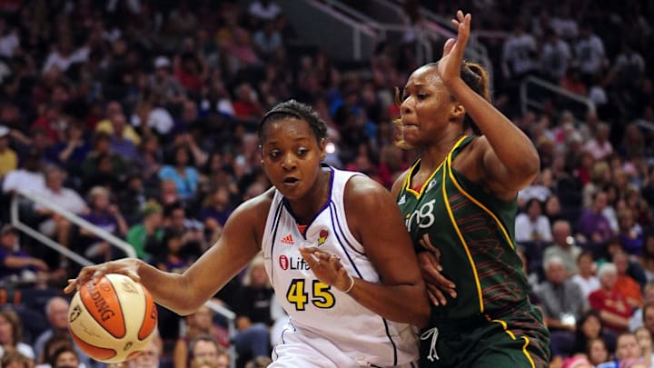 Aug 20, 2010; Phoenix, AZ, USA; Phoenix Mercury forward Kara Braxton (left) drives the ball against Seattle Storm forward Le'coe Willingham during the first half at US Airways Center.  Mandatory Credit: Jennifer Stewart-Imagn Images