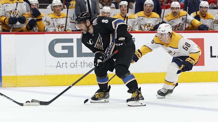 Nov 6, 2024; Washington, District of Columbia, USA; Washington Capitals left wing Alex Ovechkin (8) skates with the puck as Nashville Predators left wing Zachary L'Heureux (68) chases in the first period at Capital One Arena. Mandatory Credit: Geoff Burke-Imagn Images