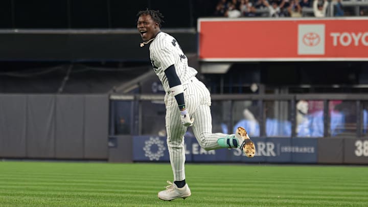 Sep 11, 2024; Bronx, New York, USA; New York Yankees third baseman Jazz Chisholm Jr. (13) celebrates after hitting a game winning RBI single during the eleventh inning against the Kansas City Royals at Yankee Stadium. Mandatory Credit: Vincent Carchietta-Imagn Images