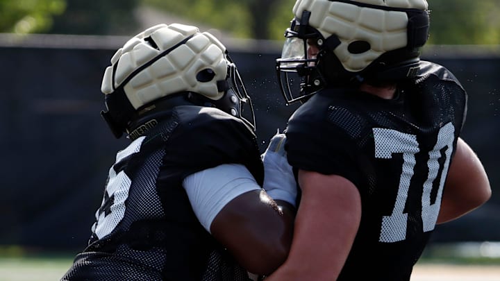 Purdue Boilermakers offensive lineman DJ Wingfield runs a drill at Bimel Outdoor Practice Complex 