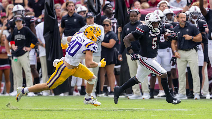 Sep 14, 2024; Columbia, South Carolina, USA; LSU Tigers linebacker Whit Weeks (40) chases South Carolina Gamecocks running back Raheim Sanders (5) during the fourth quarter at Williams-Brice Stadium. Mandatory Credit: Scott Kinser-Imagn Images