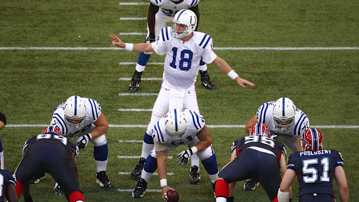 Indianapolis Colts quarterback Peyton Manning motions at the line during the preseason game against the Buffalo Bills. Indianapolis Colts quarterback Peyton Manning motions at the line during the preseason game against the Buffalo Bills.