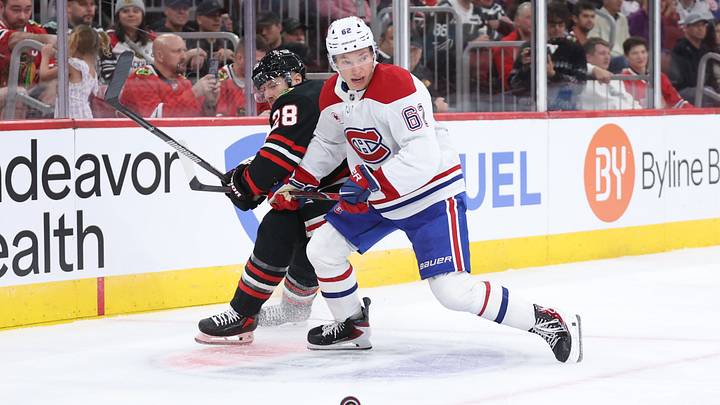 Chicago Blackhawks defenseman Ian Cole (28) and Montreal Canadiens center Owen Beck (62) battle for control of the puck during the second period at United Center. Mandatory Credit: Talia Sprague-Imagn Images