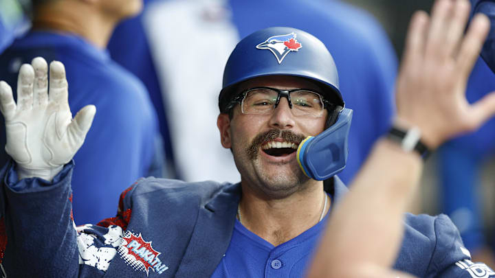 Jul 8, 2025; Chicago, Illinois, USA; Toronto Blue Jays left fielder Davis Schneider (36) celebrates with teammates in the dugout after hitting a solo home run against the Chicago White Sox during the third inning at Rate Field