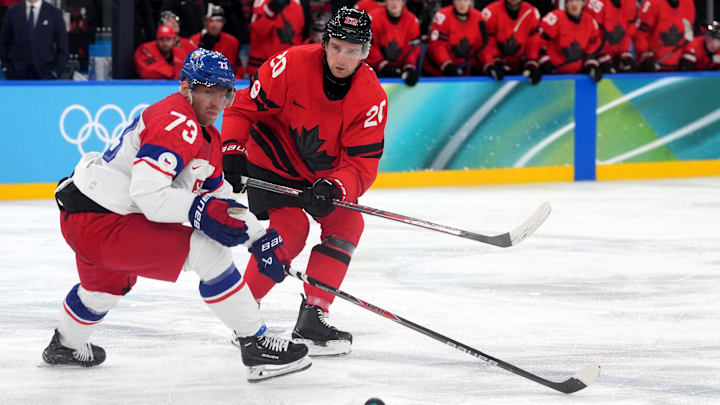 Feb 18, 2026; Milan, Italy; Ondrej Kase of Czech Republic in action with Thomas Harley of Canada in a men's ice hockey quarterfinal during the Milano Cortina 2026 Olympic Winter Games at Milano Santagiulia Ice Hockey Arena. Mandatory Credit: Amber Searls-Imagn Images