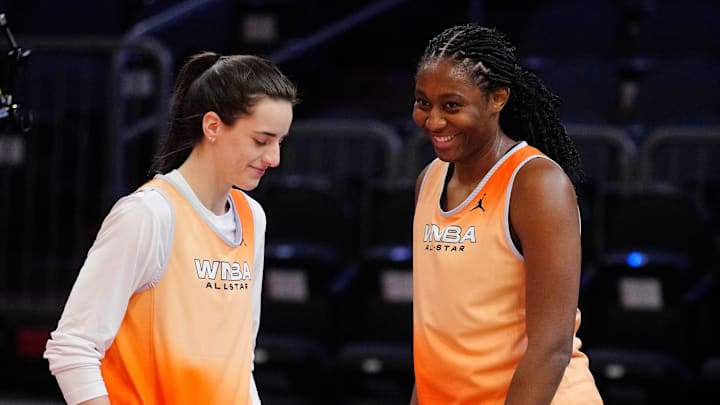 July 19, 2024; Phoenix, Ariz., U.S.; Fever guard Caitlin Clark and center Aliyan Boston laugh on the sidelines during WNBA All-Star practice on Media Day at the Footprint Center.