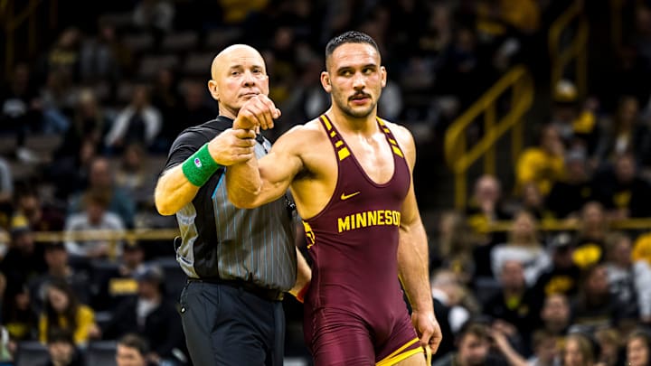 Minnesota's Isaiah Salazar has his hand raised after scoring a decision at 184 pounds during NCAA Big Ten Conference men's wrestling dual against Iowa, Monday, Jan. 15, 2024, at Carver-Hawkeye Arena in Iowa City, Iowa. Minnesota's Isaiah Salazar has his hand raised after scoring a decision at 184 pounds during NCAA Big Ten Conference men's wrestling dual against Iowa, Monday, Jan. 15, 2024, at Carver-Hawkeye Arena in Iowa City, Iowa.