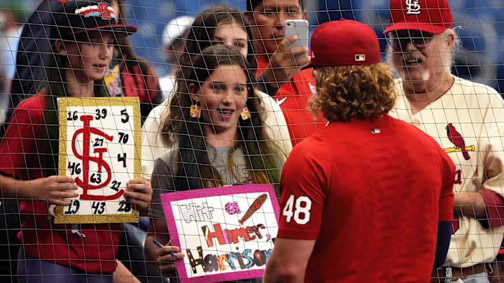 Jun 8, 2022; St. Petersburg, Florida, USA; St. Louis Cardinals fans Mallory Taylor (left, age 10) sister Josephine Taylor (middle, age 10), and Bill Goldschmitt (right) get autographs from St. Louis Cardinals center fielder Harrison Bader (48) before the Tampa Bay Rays play the St. Louis Cardinals at Tropicana Field. Mandatory Credit: Dave Nelson-Imagn Images Jun 8, 2022; St. Petersburg, Florida, USA; St. Louis Cardinals fans Mallory Taylor (left, age 10) sister Josephine Taylor (middle, age 10), and Bill Goldschmitt (right) get autographs from St. Louis Cardinals center fielder Harrison Bader (48) before the Tampa Bay Rays play the St. Louis Cardinals at Tropicana Field. Mandatory Credit: Dave Nelson-Imagn Images