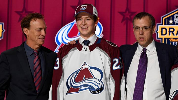 Jun 28, 2023; Nashville, Tennessee, USA; Colorado Avalanche draft pick Calum Ritchie stands with Ava staff after being selected with the twenty seventh pick in round one of the 2023 NHL Draft at Bridgestone Arena. Mandatory Credit: Christopher Hanewinckel-Imagn Images Jun 28, 2023; Nashville, Tennessee, USA; Colorado Avalanche draft pick Calum Ritchie stands with Ava staff after being selected with the twenty seventh pick in round one of the 2023 NHL Draft at Bridgestone Arena. Mandatory Credit: Christopher Hanewinckel-Imagn Images