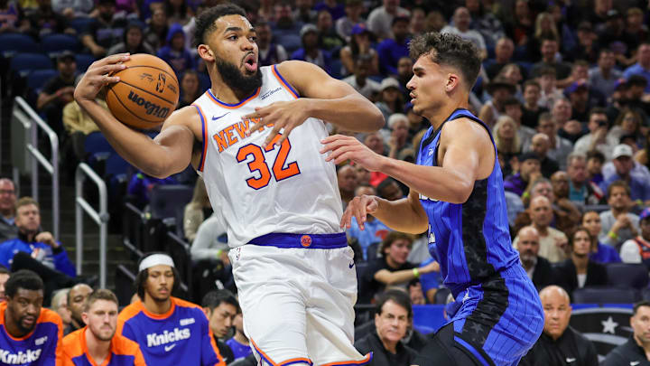 New York Knicks center Karl-Anthony Towns, defended here by Orlando Magic forward, Tristan da Silva, is listed as questionable for Sunday's matinee.