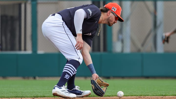 Feb 22, 2025; Lakeland, Florida, USA; Detroit Tigers second base Zach McKinstry (39) fields a ball during the third inning against the Philadelphia Phillies at Publix Field at Joker Marchant Stadium. 