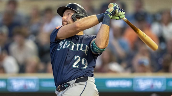 Seattle Mariners catcher Cal Raleigh hits a home run against the Minnesota Twins on June 23 at Target Field. Seattle Mariners catcher Cal Raleigh hits a home run against the Minnesota Twins on June 23 at Target Field.