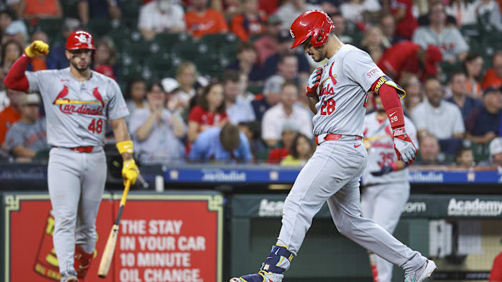 Jun 5, 2024; Houston, Texas, USA; St. Louis Cardinals third baseman Nolan Arenado (28) steps on home plate to score a run after hitting a home run during the sixth inning against the Houston Astros at Minute Maid Park. Mandatory Credit: Troy Taormina-Imagn Images
