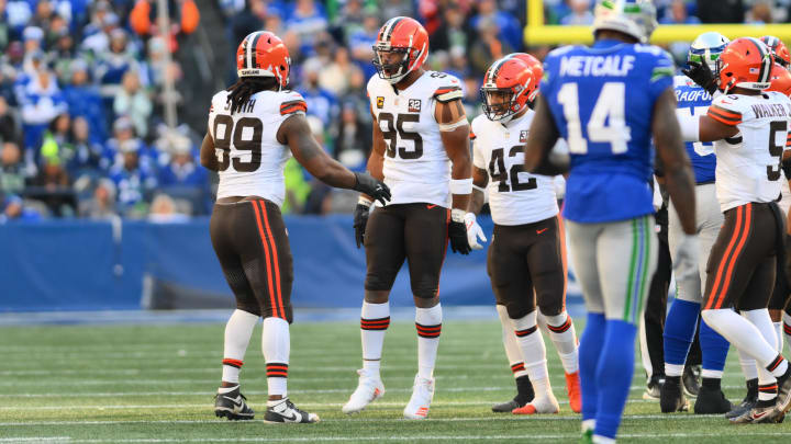 Oct 29, 2023; Seattle, Washington, USA; Cleveland Browns defensive end Za'Darius Smith (99) and defensive end Myles Garrett (95) celebrate after Garrett sacked Seattle Seahawks quarterback Geno Smith (7) (not pictured) during the second half at Lumen Field. Mandatory Credit: Steven Bisig-USA TODAY Sports
