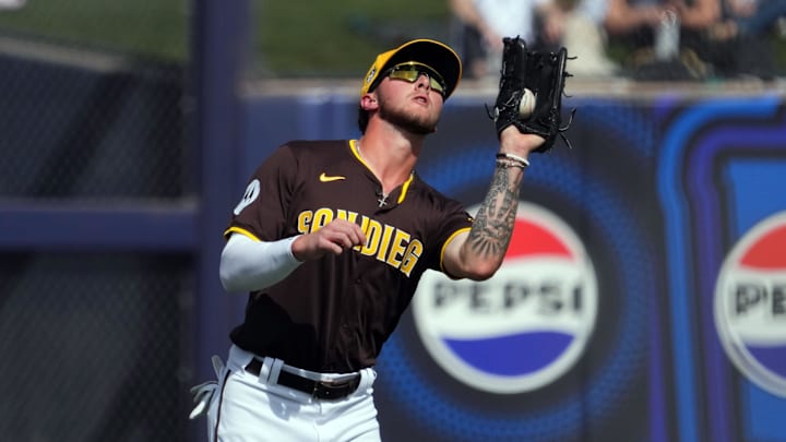 San Diego Padres left fielder Jackson Merrill catches a fly ball