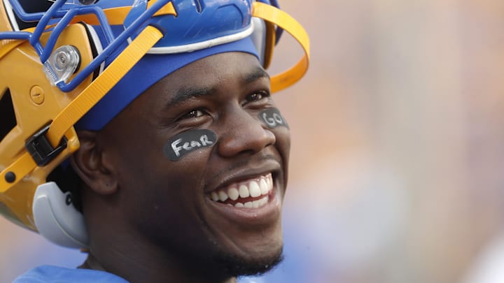 Sep 21, 2024; Pittsburgh, Pennsylvania, USA;  Pittsburgh Panthers wide receiver Konata Mumpfield (9) smiles on the sidelines during the third quarter against the Youngstown State Penguins at Acrisure Stadium. Mandatory Credit: Charles LeClaire-Imagn Images