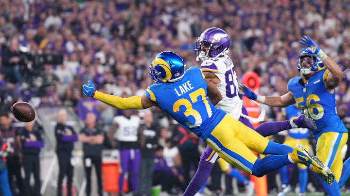 Jan 13, 2025; Glendale, AZ, USA; Los Angeles Rams safety Quentin Lake (37) dives attempting to make an interception against the Minnesota Vikings during the second half in an NFC wild card game at State Farm Stadium. Mandatory Credit: Joe Camporeale-Imagn Images