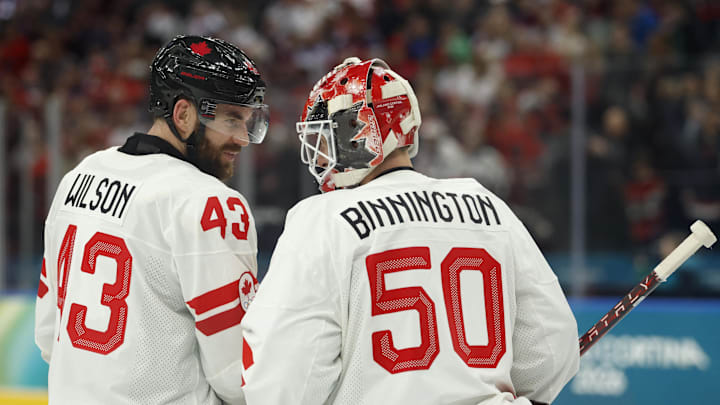 Feb 12, 2026; Milan, Italy;  Tom Wilson and Jordan Binnington of Canada  against Czechia in a men's ice hockey group A match during the Milano Cortina 2026 Olympic Winter Games at Milano Santagiulia Ice Hockey Arena. Mandatory Credit: Geoff Burke-Imagn Images