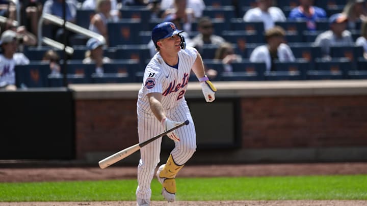 Jul 23, 2025; New York City, New York, USA; New York Mets first baseman Pete Alonso (20) hits a single against the Los Angeles Angels during the seventh inning at Citi Field. Mandatory Credit: John Jones-Imagn Images
