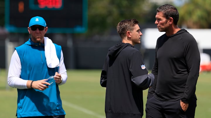 From left, Jacksonville Jaguars head coach Liam Coen, general manager James Gladstone and Tony Boselli, executive vice president of football operations, talk after an NFL training camp session at the Miller Electric Center, Thursday, Aug. 14, 2025 in Jacksonville, Fla.