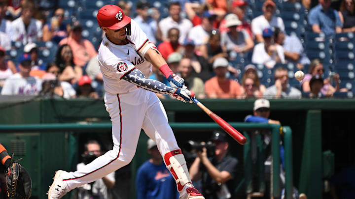 Jul 4, 2024; Washington, District of Columbia, USA; Washington Nationals first baseman Joey Meneses (45) hits the ball into play against the New York Mets during the fourth inning at Nationals Park. Jul 4, 2024; Washington, District of Columbia, USA; Washington Nationals first baseman Joey Meneses (45) hits the ball into play against the New York Mets during the fourth inning at Nationals Park.