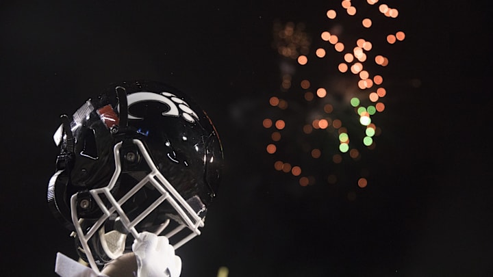 Cincinnati Bearcats player lifts his helmet after the Birmingham Bowl between Cincinnati Bearcats and Boston College Eagles on Thursday, Jan. 2, 2020, at Legion Field in Birmingham, Ala. Cincinnati Bearcats wont 38-6.

Birmingham Bowl