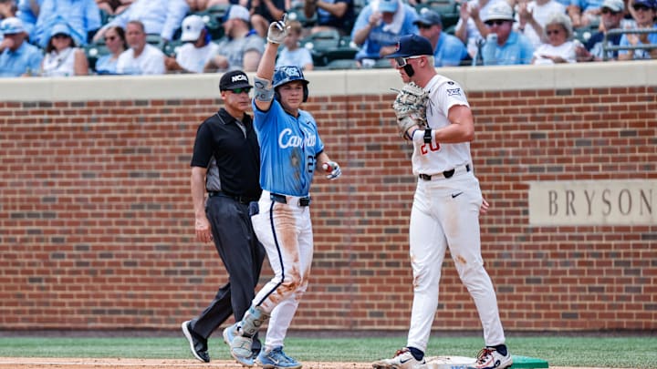 Jun 7, 2025; Chapel Hill, NC, USA;  North Carolina outfielder Kane Kepley (27) celebrates being on first base during the third inning of the Super Regionals game against Arizona in Chapel Hill, North Carolina. Mandatory Credit: Jaylynn Nash-Imagn Images