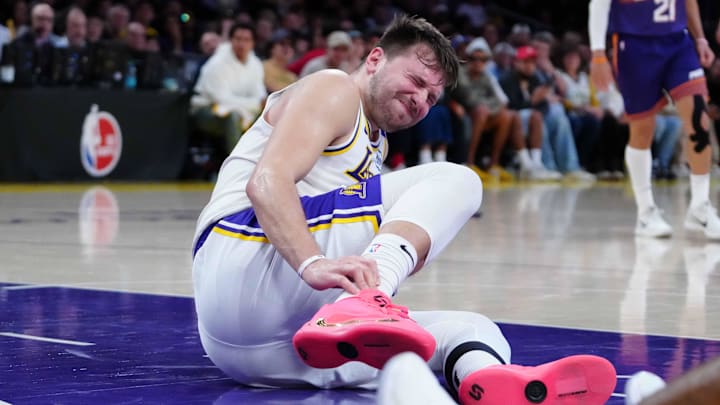 Mar 16, 2025; Los Angeles, California, USA; Los Angeles Lakers guard Luka Doncic (77) reacts against the Phoenix Suns in the second half at Crypto.com Arena. Mandatory Credit: Kirby Lee-Imagn Images