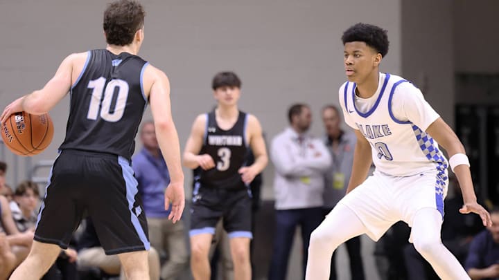 Blake's Baba Oladotun defends Whitman's Will Shapiro during Saturday's Maryland Class 4A state boys basketball state title game. Oladotun, a 6-foot-10 University of Maryland recruit, had 11 points and five rebounds off the bench in only his second - and final - game for the Bengals after missing the regular season with an ankle injury. Blake's Baba Oladotun defends Whitman's Will Shapiro during Saturday's Maryland Class 4A state boys basketball state title game. Oladotun, a 6-foot-10 University of Maryland recruit, had 11 points and five rebounds off the bench in only his second - and final - game for the Bengals after missing the regular season with an ankle injury.