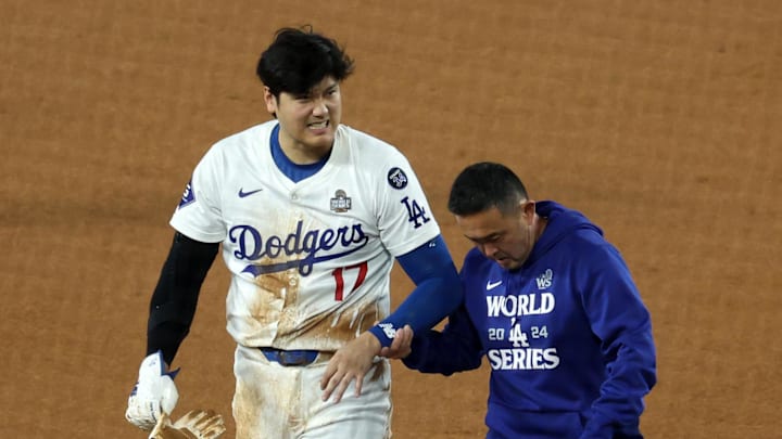 Oct 26, 2024; Los Angeles, California, USA; Los Angeles Dodgers designated hitter Shohei Ohtani (17) walks off the field after injuring his shoulder against the New York Yankees in the seventh inning for game two of the 2024 MLB World Series at Dodger Stadium. Mandatory Credit: Kiyoshi Mio-Imagn Images Oct 26, 2024; Los Angeles, California, USA; Los Angeles Dodgers designated hitter Shohei Ohtani (17) walks off the field after injuring his shoulder against the New York Yankees in the seventh inning for game two of the 2024 MLB World Series at Dodger Stadium. Mandatory Credit: Kiyoshi Mio-Imagn Images