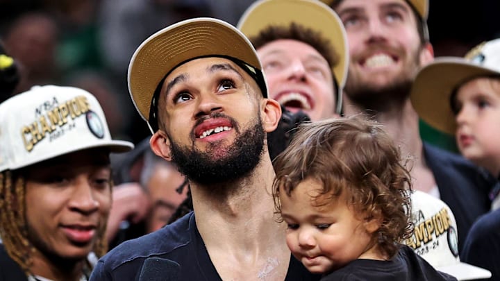 Jun 17, 2024; Boston, Massachusetts, USA; Boston Celtics guard Derrick White (9) celebrates after beating the Dallas Mavericks in game five of the 2024 NBA Finals to win the NBA Championship at TD Garden. Mandatory Credit: Peter Casey-USA TODAY Sports