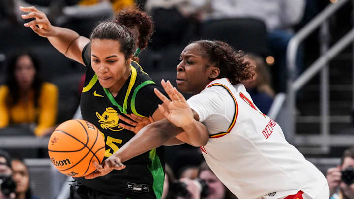 Oregon Ducks forward Ehis Etute (35) and Maryland Terrapins forward Isimenme Ozzy-Momodu (9) go for the ball Thursday, March 5, 2026, during a Big Ten women's basketball tournament game at Gainbridge Fieldhouse in Indianapolis.