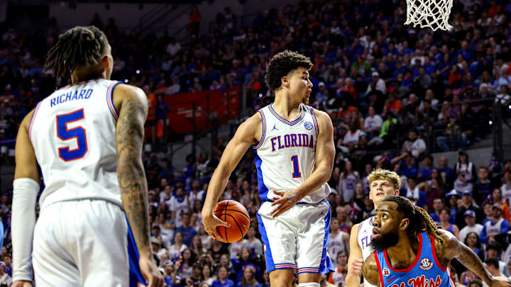 Walter Clayton Jr. attempts a behind-the-back pass in the Florida Gators' 90-71 win over Ole Miss. The senior has accounted for eight assists in each of the last two games. Walter Clayton Jr. attempts a behind-the-back pass in the Florida Gators' 90-71 win over Ole Miss. The senior has accounted for eight assists in each of the last two games.