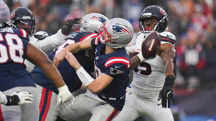 Jan 18, 2026; Foxborough, MA, USA; Houston Texans defensive end Danielle Hunter (55) blocks a throw by New England Patriots quarterback Drake Maye (10) in the first half in an AFC Divisional Round game at Gillette Stadium. Mandatory Credit: David Butler II-Imagn Images