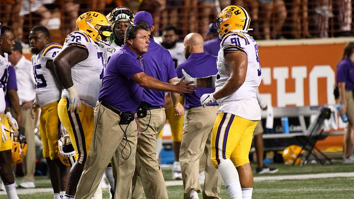 Sep 7, 2019; Austin, TX, USA; Louisiana State Tigers head coach Ed Orgeron and defensive lineman Breiden Fehoko (91) in the second half against the Texas Longhorns at Darrell K Royal-Texas Memorial Stadium. Mandatory Credit: Scott Wachter-Imagn Images