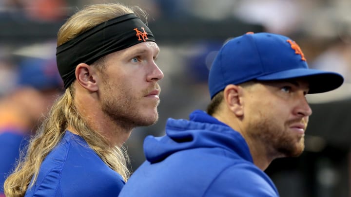 Aug 24, 2021; New York City, New York, USA; New York Mets injured starting pitchers Noah Syndergaard (34) and Jacob deGrom (48) watch from the dugout during the second inning against the San Francisco Giants at Citi Field. Mandatory Credit: Brad Penner-USA TODAY Sports