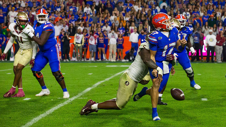 Florida State Seminoles defensive lineman Jared Verse (5) sacks Florida Gators quarterback Max Brown (17) at Steve Spurrier Field at Ben Hill Griffin Stadium in Gainesville, FL on Saturday, November 25, 2023 during the second half. Florida State won 24-15. [Doug Engle/Gainesville Sun]