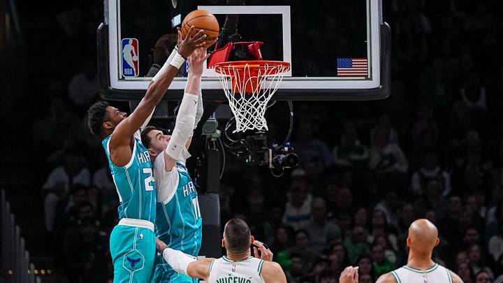 Charlotte Hornets center Ryan Kalkbrenner (11), forward Brandon Miller (24) and guard Kon Knueppel make a basket Charlotte Hornets center Ryan Kalkbrenner (11), forward Brandon Miller (24) and guard Kon Knueppel make a basket