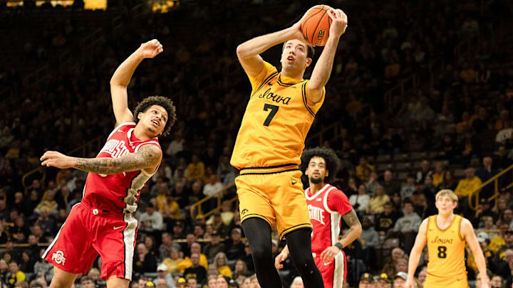 Iowa forward Alvaro Folgueiras (7) catches a pass during a basketball game against the Ohio State Buckeyes Feb. 25, 2026 at Carver-Hawkeye Arena in Iowa City, Iowa.