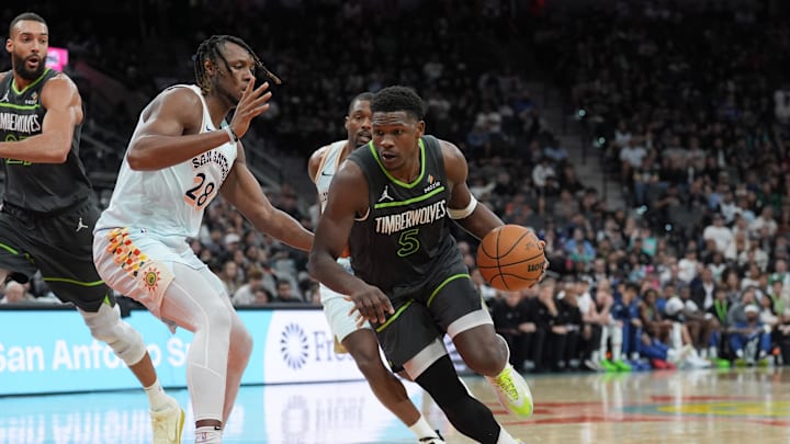Dec 15, 2024; San Antonio, Texas, USA; Minnesota Timberwolves guard Anthony Edwards (5) dribbles against San Antonio Spurs center Charles Bassey (28) in the first half at Frost Bank Center. Dec 15, 2024; San Antonio, Texas, USA; Minnesota Timberwolves guard Anthony Edwards (5) dribbles against San Antonio Spurs center Charles Bassey (28) in the first half at Frost Bank Center.