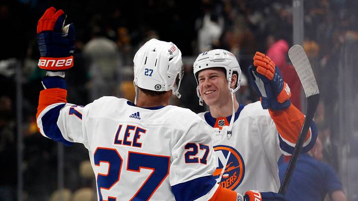 Feb 20, 2024; Pittsburgh, Pennsylvania, USA; New York Islanders left wing Anders Lee (27) and left wing Matt Martin (17) celebrate after defeating the Pittsburgh Penguins in overtime at PPG Paints Arena. New York won 5-4 in overtime. Mandatory Credit: Charles LeClaire-USA TODAY Sports