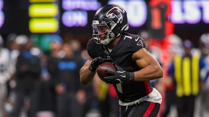 Jan 5, 2025; Atlanta, Georgia, USA; Atlanta Falcons running back Bijan Robinson (7) runs the ball against the Carolina Panthers in the second quarter at Mercedes-Benz Stadium. Mandatory Credit: Brett Davis-Imagn Images
