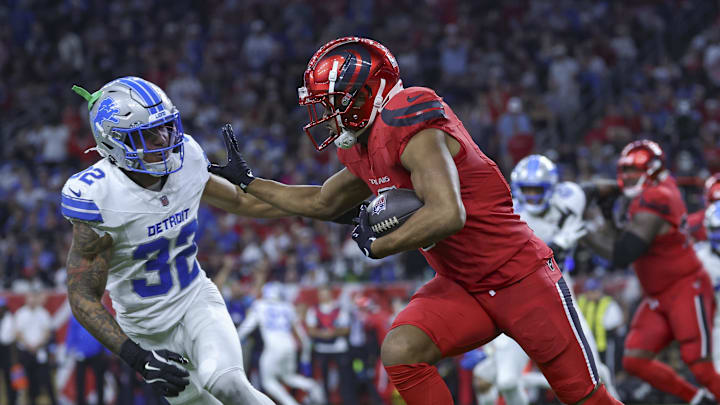 Houston Texans wide receiver Robert Woods (2) runs with the ball as Detroit Lions safety Brian Branch (32) defends