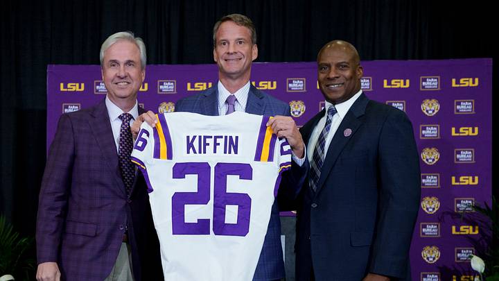 Dec 1, 2025; Baton Rouge, LA, USA; LSU president Wade Rousse, left, LSU new head coach Lane Kiffin and LSU athletic director Verge Ausberry stand together at South Stadium Club at Tiger Stadium. Mandatory Credit: Matthew Hinton-Imagn Images Dec 1, 2025; Baton Rouge, LA, USA; LSU president Wade Rousse, left, LSU new head coach Lane Kiffin and LSU athletic director Verge Ausberry stand together at South Stadium Club at Tiger Stadium. Mandatory Credit: Matthew Hinton-Imagn Images