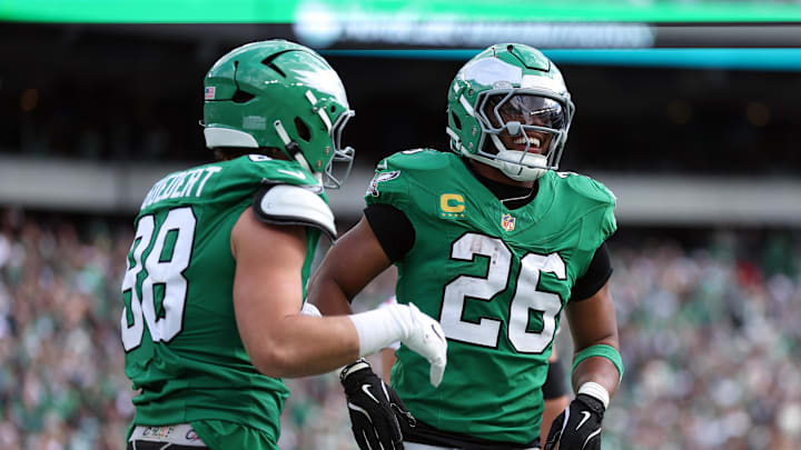 Oct 26, 2025; Philadelphia, Pennsylvania, USA; Philadelphia Eagles tight end Dallas Goedert (88) celebrates scoring a touchdown with running back Saquon Barkley (26) in the second quarter against the New York Giants at Lincoln Financial Field. Mandatory Credit: Bill Streicher-Imagn Images