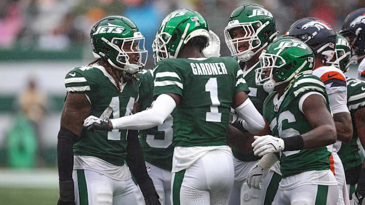 Sep 29, 2024; East Rutherford, New Jersey, USA; New York Jets linebacker Jamien Sherwood (44) and cornerback Sauce Gardner (1) celebrate a defensive stop during the first half against the Denver Broncos at MetLife Stadium. Mandatory Credit: Vincent Carchietta-Imagn Images