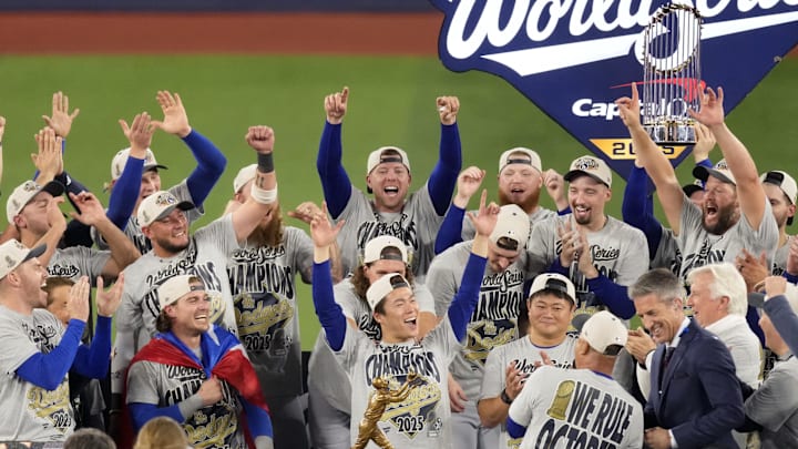 Nov 1, 2025; Toronto, Ontario, CAN; Los Angeles Dodgers pitcher Yoshinobu Yamamoto (18) celebrates on the podium after defeating the Toronto Blue Jays in game seven of the 2025 MLB World Series at Rogers Centre. Mandatory Credit: Kevin Sousa-Imagn Images