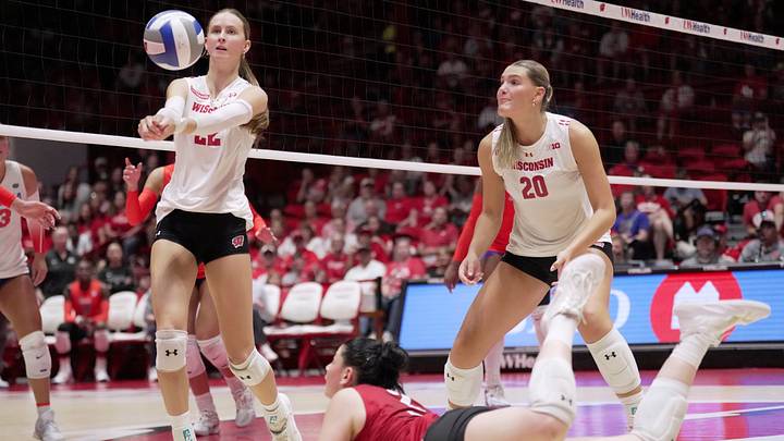 Wisconsin outside hitter Audrey Flanagan (22) hits the ball after a save by libero/defensive specialist Anna Bardaro (2) during their match against Florida Wednesday, Sept. 2, 2026 at the UW Field House in Madison, Wisconsin. Wisconsin beat Florida in five sets.